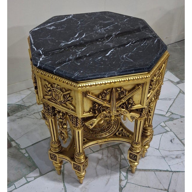 Matching pair of French Louis XVIstyle Neoclassical side tables, distinguished by their architectural form, rich gilt...
