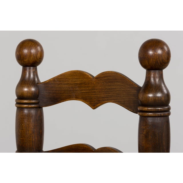 A set of six French Modernist dining chairs crafted from solid oak and sourced in Provence, France. Defined by their...
