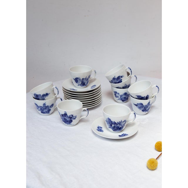 This 11-piece coffee set from the Danish firm Royal Copenhagen, part of their "Blå Blomst" (Blue Blossom) collection, is a...