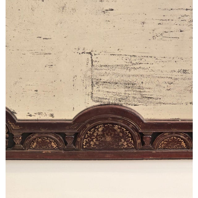 A rare Western Chinese lacquered & gilt mirror, decorated with Islamic motifs, 19th century.