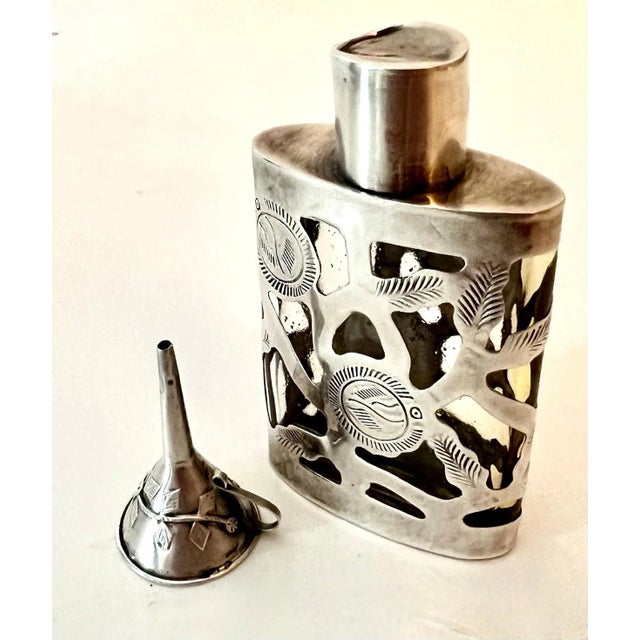 A Mexican Sterling Siver Filagree perfume bottle with Sterling funnel - the duo are quite attractive and ready to use!...