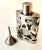 A Mexican Sterling Siver Filagree perfume bottle with Sterling funnel - the duo are quite attractive and ready to use!...