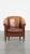 Offered this tough, timeless, cognac colored sheep leather club chair with an insane vintage look. This amazing sheep...