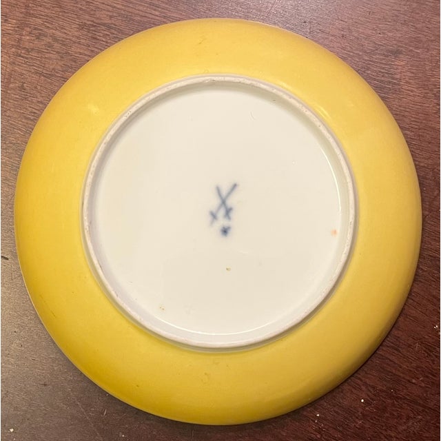 Antique 19th century Meissen porcelain saucer dish decorated with flowers and a bright yellow ground on the back. Saucer...