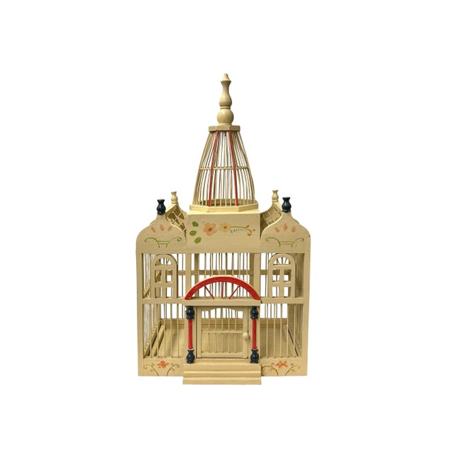 Presenting a meticulously handcrafted wooden bird cage, a true testament to traditional artistry and architectural charm....