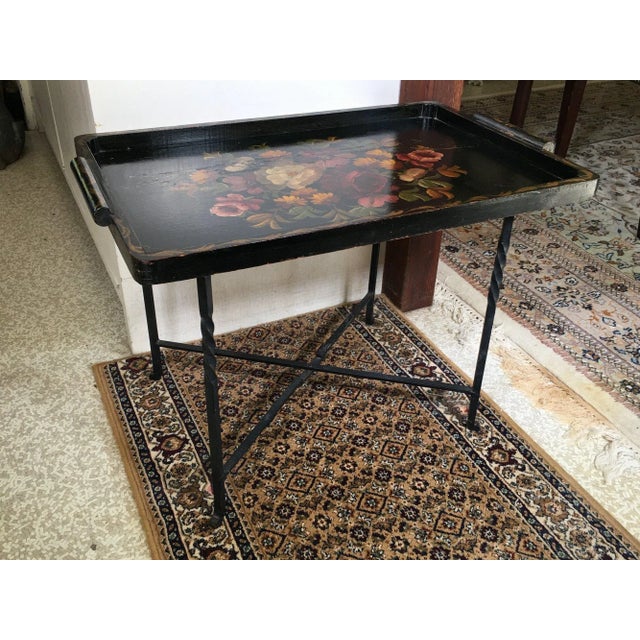 Antique English tole hand-painted tray top on a black wrought iron base. Product Information: Materials: Wood, Paint,...