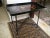 Antique English tole hand-painted tray top on a black wrought iron base. Product Information: Materials: Wood, Paint,...