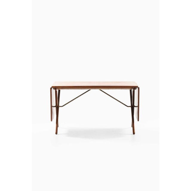 The rare dining table model at-309, designed by hans j. Wegner and produced by andreas tuck in denmark, is a prime example...