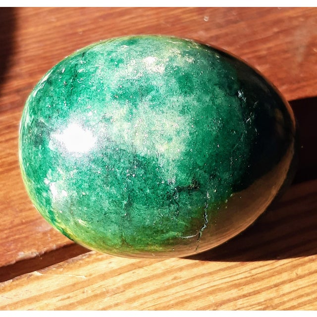 An exquisite mid-century decorative marble egg that stands out with its stunning emerald green hue! This life-sized...