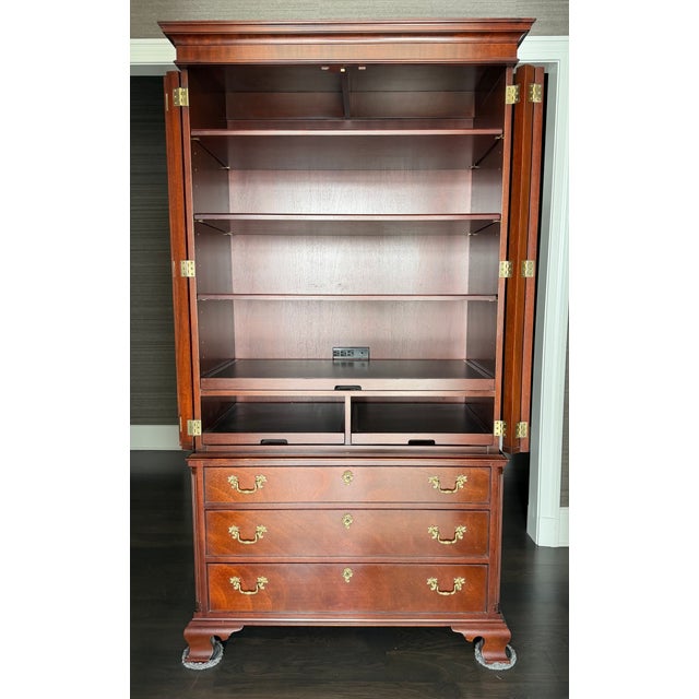 Beautifully crafted 1990s mahogany armoire/storage cabinet by Kindel Furniture, the highly regarded American furniture...