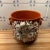 Large Italian ceramic cachepot with incredible molded flowers and chic molded faux handles. In very good condition with a...