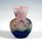 Small baluster vase, with a bulbous body resting on a flush base, featuring a flared, funnel-shaped neck; colourless glass...