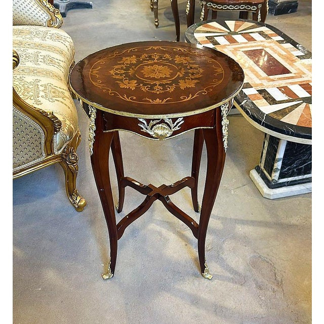 In love with the floral design on the top of the table. Beautiful side table with gold details. This table can be used for...