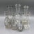 This set of seven antique carafes impresses with its elegant simplicity and timeless appeal. The bottles vary in shape and...
