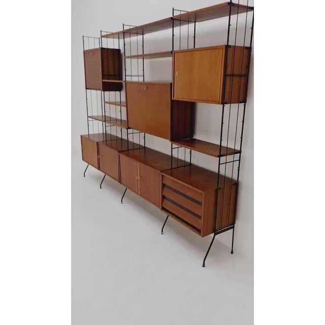 Freestanding string shelf-system unit bookcase teak & metal by Silverschild Germany, 1950s The individual units and...