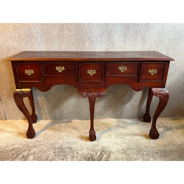 Solid mahogany Chippendale console table or sideboard with 5 drawers. Features solid wood construction dovetailed joints,...