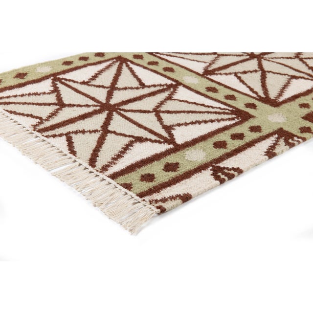 The serene beauty of the Star Rug was inspired by Moroccan tiles and antique American quilts. Symmetrical starbursts...