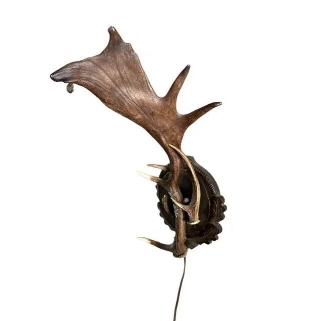 A 1940s antler wall sconce — classic lodge and chalet lighting for a hallway, bedroom, or beside a stone fireplace. The...