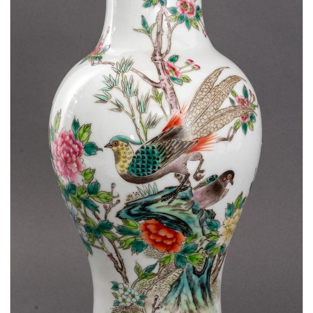 Pair of Famille Rose Glazed Porcelain Vases Mounted as Table Lamps, each hand-painted with birds amongst lotus flowers...