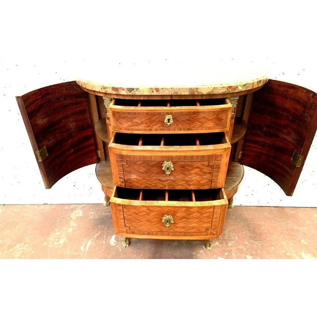 Louis xvi style half-moon chest of drawers. Amaranth and rosewood veneer on oak. three drawers on the front with marquetry...