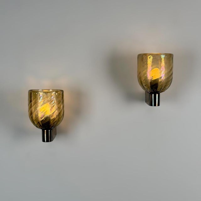 A rare and exceptionally atmospheric pair of wall sconces designed by archimede seguso for seguso vetri d'arte during the...