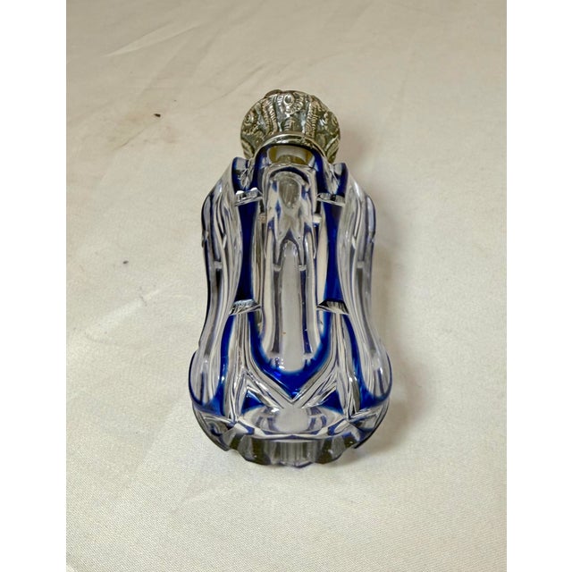 This antique 19th century European cut to clear crystal and sterling silver perfume bottle is a beautifully crafted...