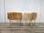 An elegant pair of bedside tables dating back to the 1950s, featuring soft, rounded lines typical of period design. Made...