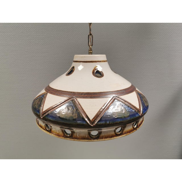 Large ceramic pendant lamp from the danish brand axella, 1970s. designed by axel larsen (founder of axella) and crafted in...