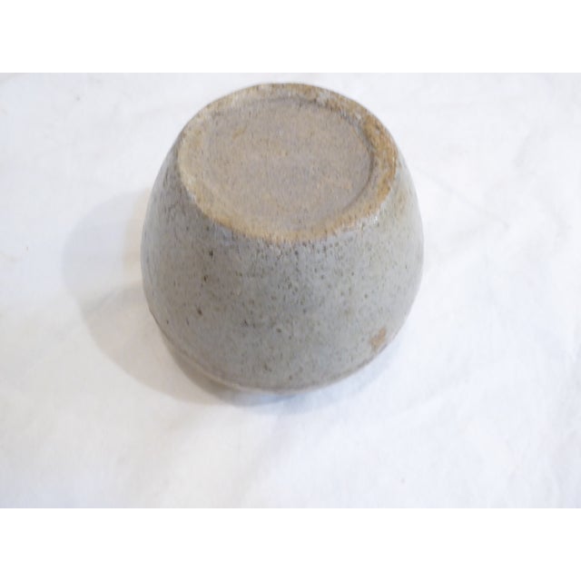 This Chinese ceramic storage vessel has an old rustic patina.