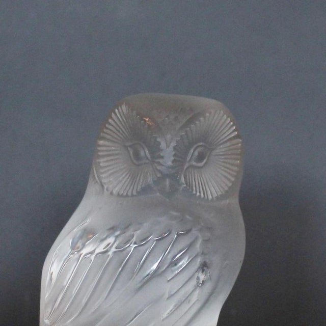 Chouette, an art deco glass paperweight. A frosted and clear glass paperweight in the form of a curious owl set over a...