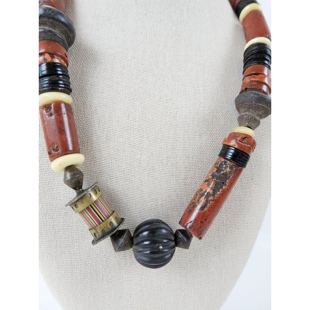 1990's one of a kind atist studio made beaded necklace using bauxite, cow horn, antique pottery spindle whorls, glass...