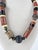 1990's one of a kind atist studio made beaded necklace using bauxite, cow horn, antique pottery spindle whorls, glass...