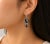 Elegant 18K white gold drop earrings featuring black and white brilliant-cut diamonds totaling 2 carats. Estate piece...