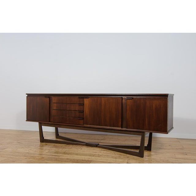 This unique sideboard was manufactured by Stonehill in the 1960s and is an excellent example of Mid-Century Modern design....