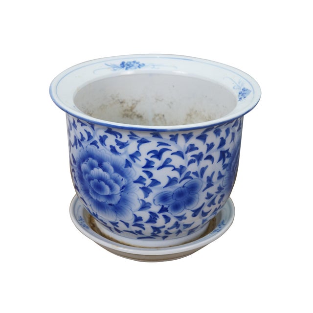 Pair of mid to early 20th century blue and white porcelain planters / jardinieres. Round form with flared rim, drain...