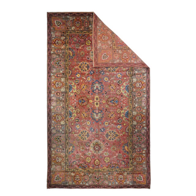 The rust-rose-salmon field shows a close rendition of the classic “In-and-out” palmette 17th century pattern around a four...