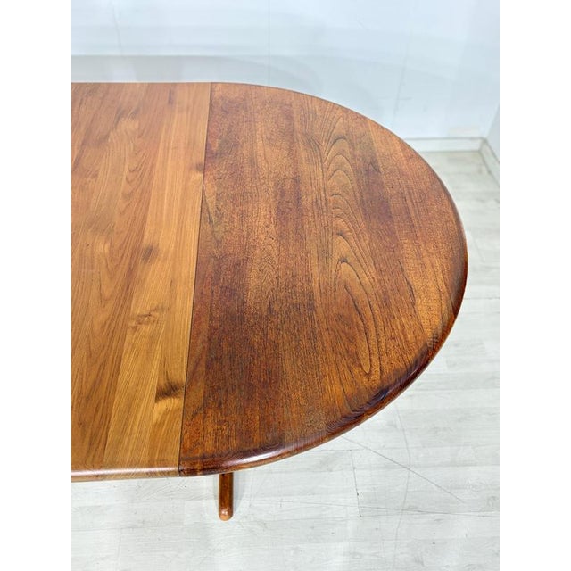 For sale is a beautiful vintage Dyrlund teak dining table with two extension leaves. Danish design, 1960s, solid teak....