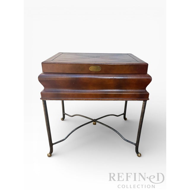 An elegant English Regency Revival storage side table featuring a hinged rectangular top with geometric line inlay and a...