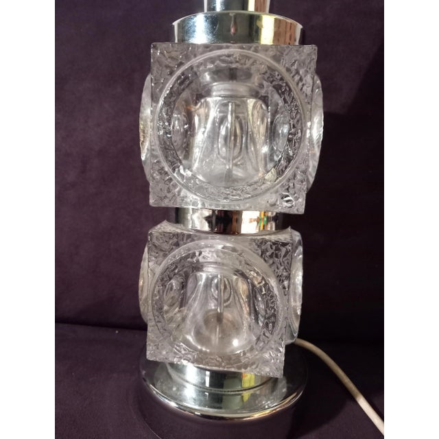 The table lamp is equipped with 2x E27 sockets and is in very good working condition. I have official proof of...