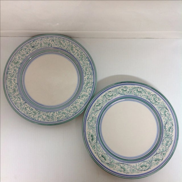 Pair of Artistica Italy ceramic display chargers. Pastel blues and greens. A terrific, colorful accent to any dining room...