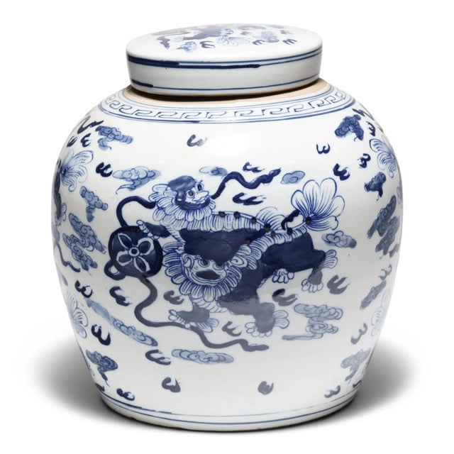 This round, porcelain storage jar is brightly glazed in the classic blue-and-white manner. A combination of stenciled...