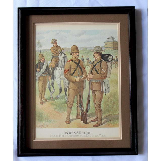 A striking pair of antique European military uniform prints, beautifully matted and framed in classic black wood frames....