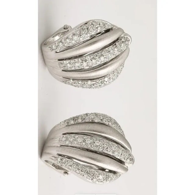 Wonderful Italian White gold and Diamond Clip-on Earrings. Circa 1950s with full cut Diamond set in 3 rows. Marked with...