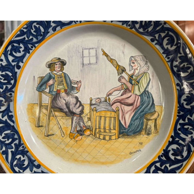 Decorate a wall of a shelf with this colorful antique platter. Created in Brittany, France circa 1920, the hand painted...