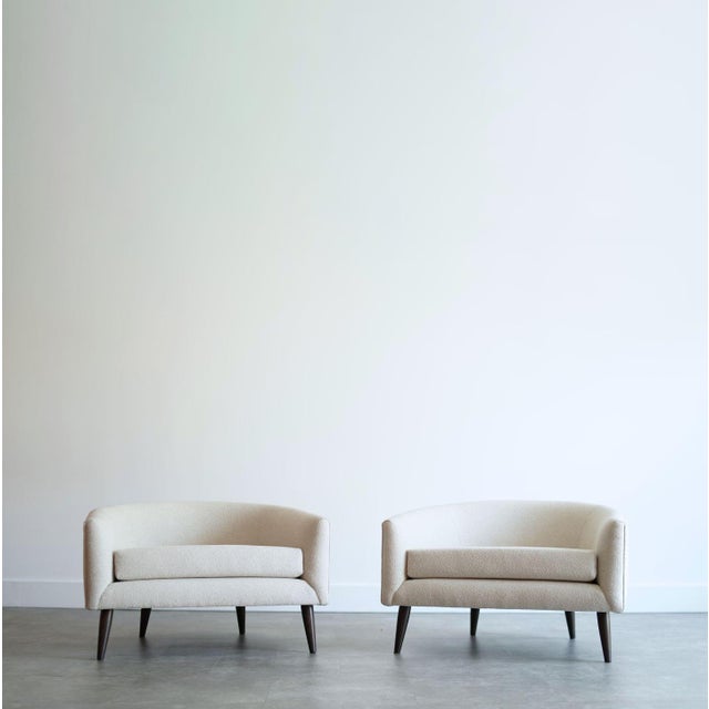 A stunning pair of low-profile barrel back lounge chairs in the style of Adrian Pearsall, circa 1950s. Expertly restored...