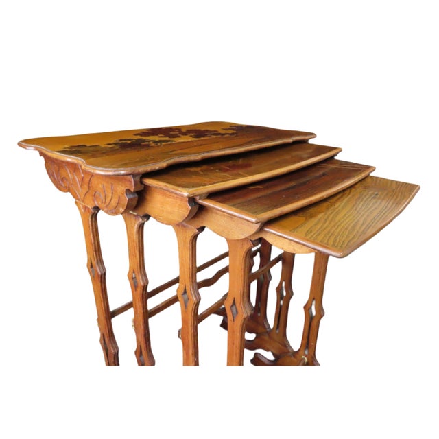 Absolutely stunning set of 4 Émile Gallé nesting tables with intricate marquetry depicting a natural landscape and...