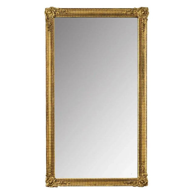 Dimensions: 68 ½ ” H x 37 ½ ” W x 2 ⅝ ” D The rippling texture of this antique French symmetrical mirror dazzles in the...