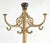 Victorian styled steel coat tree rack with a bright gold painted finish and elaborate scrolling details around the base...