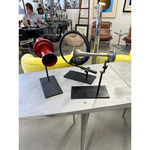 A nice collection of mounted vintage car horns. These are likely early to middle 20th century examples. They are mounted...