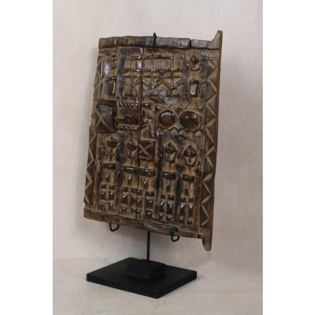Dogon granary doors originate from the Dogon people of the Bandiagara Escarpment region of Mali. These doors protected the...